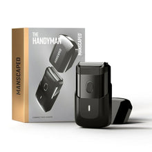 Black compact foil face shaver with protective cap and charging dock stand