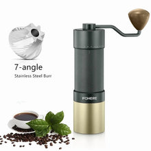 Manual coffee grinder with gold and black body, conical burrs, and hand crank handle
