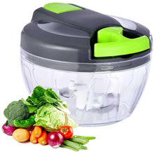 Manual food chopper with clear bowl and green push lid, showing chopping blade inside