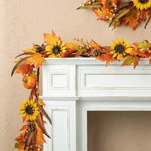 Fall leaf and sunflower garland with small pumpkins and pinecone-like accents on mantle