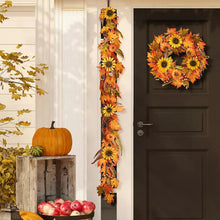 Fall leaf and sunflower garland with layered faux leaves and blooms, hanging vertically