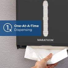 Black folded paper towel dispenser dispensing towels from front slot