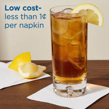 White beverage napkin placed under a cold drink with lemon slices