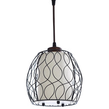 Wire cage lamp shade with diamond pattern on a dark floor lamp pole.