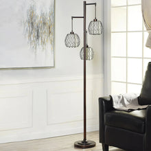 3-light floor lamp with three dark metal cage shades on a slender pole