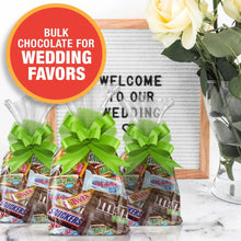 Candy favors with Snickers, Twix, Milky Way, 3 Musketeers, and M&M's, with green bows.