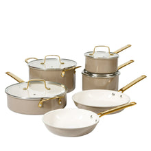Nonstick pots and pans set with beige lids, taupe pots, gold handles