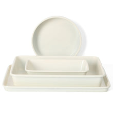 White 4-piece metal bakeware set with round dish and two rectangular baking pans