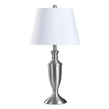 Table lamp with white drum shade and brushed-silver pedestal base