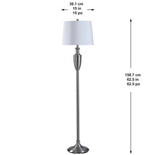 Floor lamp with white drum shade and silver vertical pole base