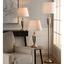 Lamp set of three with metal stems, white drum shades, and tiered bases