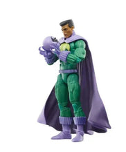 Green and purple action figure standing with raised fists, yellow chest emblem, cape