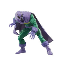 Green and purple action figure crouching with purple cape, clawed hands, armored boots