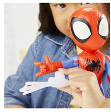 Spidey action figure close-up in hands, red mask and blue suit with black spider emblem