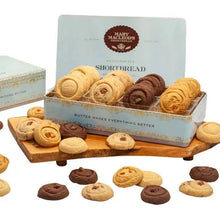 Mary Macleod’s shortbread tin with assorted cookies, open view on a stand