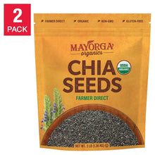 Mayorga organic chia seeds pouch with view of dark chia seeds in a wooden scoop