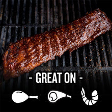Grilled sausage with pepper-speckled rub on black grill grates.