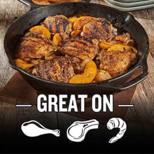 Brown sugar bourbon seasoning-coated chicken in skillet with dark grill marks