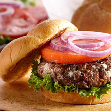 Hamburger on bun with lettuce, tomato, and sliced onion