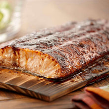 Seasoned roasted salmon on tray with smoky spice rub