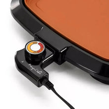 Electric grill control dial with indicator light on black housing, with power cord
