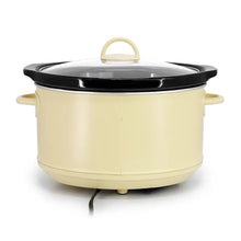 Cream electric slow cooker with black lid and side handles, front view