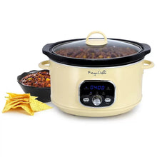 Cream electric slow cooker with black lid, digital panel, pot filled with food