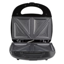 Electric sandwich maker with hinged lid closed and textured sandwich plates