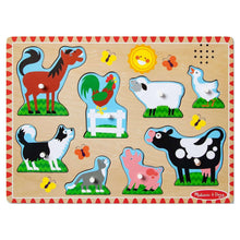 Farm animal sound puzzle board with illustrated animals, paw prints, and peg grid