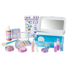 Pretend makeup play set with open blue case, mirror, brushes, lipstick tubes, and powder jars