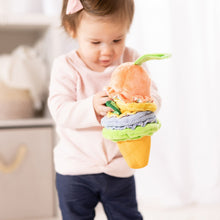 Ice cream clip-on plush toy in a child’s hands, with green ribbon and layered fabrics