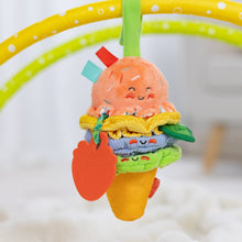 Clip-on ice cream plush toy with peach face, stacked fabric layers, and orange teether