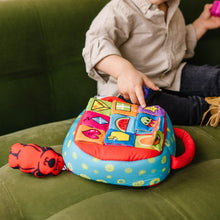 Take-Along shape sorter activity bag with fabric side panels and colorful blocks