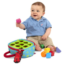 Take-Along shape sorter with colorful blocks and green hole panel for babies
