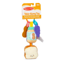 Melissa & Doug take-along toy package with soft clip-on bread and purple flower pieces