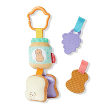 Take-along clip-on infant toy with bread slice, purple flower tag, and waffle heart charms