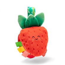 Plush red berry teether with green leaves and multicolor fabric tags