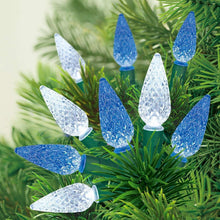 LED C6 string lights on evergreen branches with blue and white bulbs