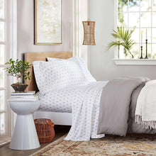 White printed sheet set with small geometric dot pattern on pillowcase and fitted sheet