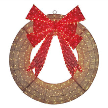 Pre-lit wreath with large red bow on gold-toned ring with warm white lights