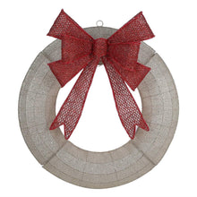 Pre-lit wreath with red mesh bow on glittery gray ring with small warm lights