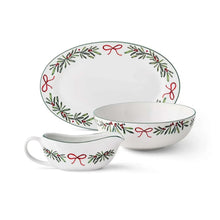 Porcelain oval plates and bowls with holiday wreath bow border, plus matching mugs