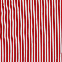 Quilted red fabric with vertical white stripes for a holiday tree skirt