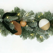 Pre-lit evergreen garland segment with pinecones, ribbon bows, and round ornaments