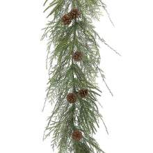 Hanging cypress garland strand with pinecones on green needle foliage