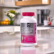Women's 50+ multivitamin bottle with pink cap, shown upright with tablets