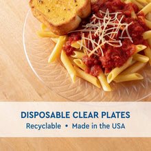 Clear plastic plate with pasta and salad, disposable 9-inch size