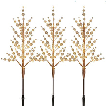 Warm-white crystal bead pathway light trees, three with gold beads on dark stakes