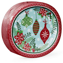 Oval holiday paper plate with red border and ornament pattern, close angled view