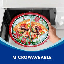 Oval holiday paper plate with ornament pattern holding pizza in an open microwave door
